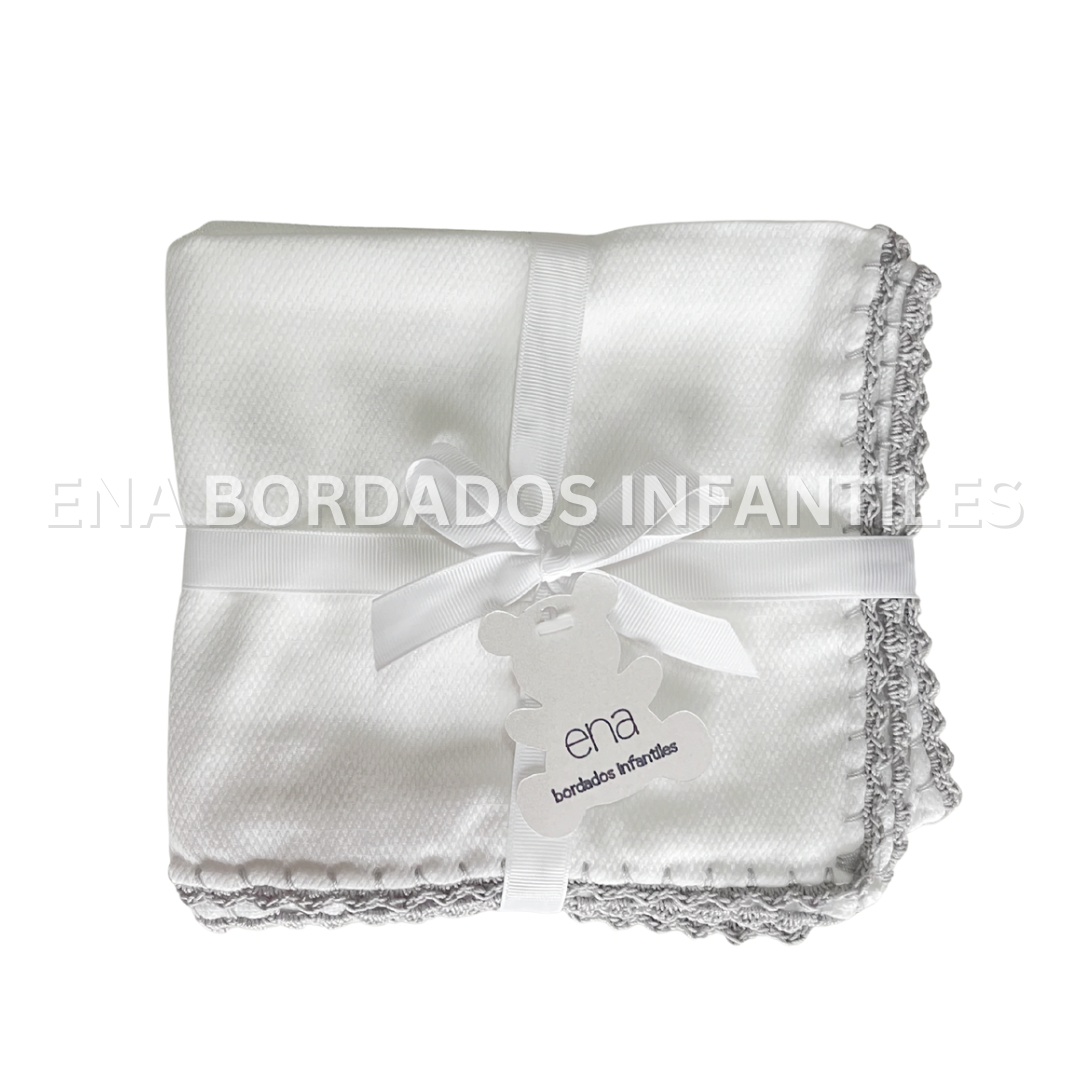 Mantita ojo de perdiz orilla crochet gris